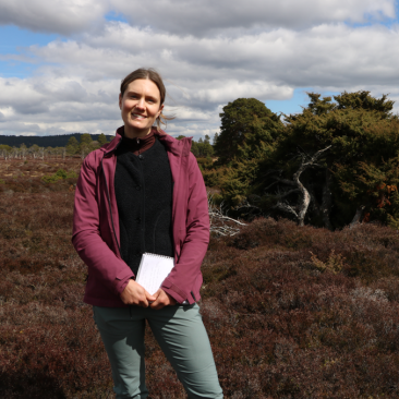 Image of Amy standing outside in heathland area